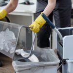 Office cleaning emptying waste bin